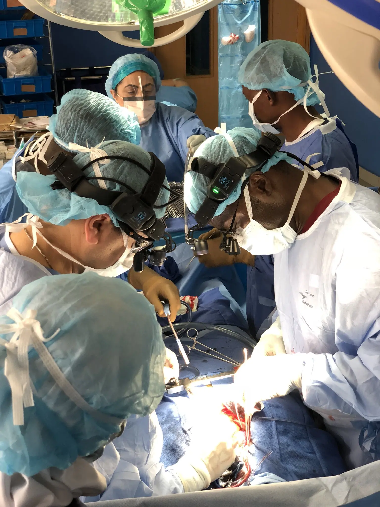 Medical professionals performing vascular procedure